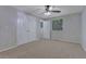 Bedroom featuring a ceiling fan, double closets, and carpeting at 5295 Old Trail Cir, Stone Mountain, GA 30088