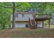 Back of house with spacious deck and large yard at 5295 Old Trail Cir, Stone Mountain, GA 30088