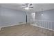 Open-concept living room featuring smooth floors, and contemporary lighting at 5295 Old Trail Cir, Stone Mountain, GA 30088