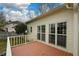 Back of the house with a wooden deck and large windows at 118 Heritage Way, Peachtree City, GA 30269