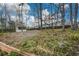 A storage shed sits in the spacious tree-lined backyard of this home at 118 Heritage Way, Peachtree City, GA 30269