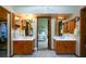Spacious bathroom with dual vanities, walk-in closet, and a view into the bedroom at 118 Heritage Way, Peachtree City, GA 30269
