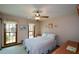 Cozy bedroom with natural light, ceiling fan, and neutral tones for a relaxing atmosphere at 118 Heritage Way, Peachtree City, GA 30269