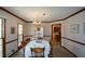 Traditional dining room with wood trim, chandelier and an adjacent doorway to the kitchen at 118 Heritage Way, Peachtree City, GA 30269