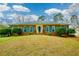 Charming brick home featuring blue shutters and manicured landscaping at 118 Heritage Way, Peachtree City, GA 30269