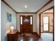 Welcoming foyer with beautiful wood floors and trim and a solid wood front door with sidelights at 118 Heritage Way, Peachtree City, GA 30269