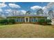 Attractive brick home with beautiful blue shutters and a well-maintained lawn at 118 Heritage Way, Peachtree City, GA 30269