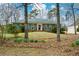 Charming brick home with well-manicured landscaping, enhanced by springtime blooms at 118 Heritage Way, Peachtree City, GA 30269