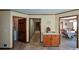 Bright hallway with wood trim, leading to the laundry room, dining room, and stairs to the second floor at 118 Heritage Way, Peachtree City, GA 30269