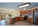 Bright eat-in kitchen with natural lighting, stainless steel appliances and an abundance of cabinet space at 118 Heritage Way, Peachtree City, GA 30269