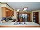 Spacious kitchen featuring wood cabinets, stainless steel appliances and a walk in pantry with custom shelving at 118 Heritage Way, Peachtree City, GA 30269