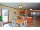 Open kitchen area with a breakfast nook and stainless steel appliances at 118 Heritage Way, Peachtree City, GA 30269