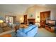 Large living room with fireplace, built-in bookshelves, and plenty of natural light at 118 Heritage Way, Peachtree City, GA 30269