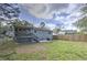 Spacious backyard featuring a covered deck, patio area, and a well-maintained lawn at 1460 Parkmont Dr, Roswell, GA 30076