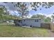 Home's backyard with fenced lawn, deck, and patio - ideal for outdoor gatherings and relaxation at 1460 Parkmont Dr, Roswell, GA 30076