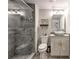 Bathroom with a glass shower, gray marble tiles, vessel sink and vanity at 1460 Parkmont Dr, Roswell, GA 30076