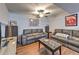 Cozy living room with leather sofas, ceiling fan, and decor at 1460 Parkmont Dr, Roswell, GA 30076