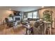 Comfortable living room with a stone fireplace, hardwood floors, and a large sectional sofa at 1460 Parkmont Dr, Roswell, GA 30076