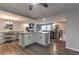 Open living space with a modern kitchen, dining area, and living room with hardwood floors at 1460 Parkmont Dr, Roswell, GA 30076