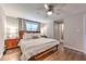 Main bedroom boasts hardwood floors, a ceiling fan, and easy access to an en-suite bathroom at 1460 Parkmont Dr, Roswell, GA 30076