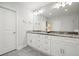 Bathroom with double vanity, granite countertop, decorative fixtures, and excellent lighting at 2162 Brookview Nw Dr, Atlanta, GA 30318