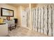 Bright bathroom with a shower, stylish curtain, gray vanity, and wood-look flooring at 2162 Brookview Nw Dr, Atlanta, GA 30318