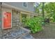 Stone entryway with a red door surrounded by greenery at 2162 Brookview Nw Dr, Atlanta, GA 30318