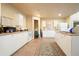Well-lit kitchen with white cabinetry and modern appliances, complemented by a stylish rug at 2162 Brookview Nw Dr, Atlanta, GA 30318