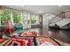 Bright living room featuring large windows, hardwood floors, and unique, colorful decorations at 2162 Brookview Nw Dr, Atlanta, GA 30318