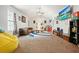 Cozy living room features a comfortable couch, colorful rug, vaulted ceilings, and a ceiling fan at 2162 Brookview Nw Dr, Atlanta, GA 30318