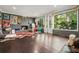 Spacious living room featuring hardwood floors, a fireplace, and large windows at 2162 Brookview Nw Dr, Atlanta, GA 30318