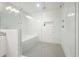 Luxurious shower with marble tile, glass enclosure, rainfall showerhead, and built-in tub at 2162 Brookview Nw Dr, Atlanta, GA 30318
