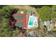Aerial view of the community amenities featuring tennis courts, a pool, and surrounding trees at 3255 Sutcliffe Nw Rdg, Marietta, GA 30064