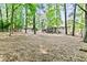 Expansive backyard with mature trees offering ample space for recreation and outdoor activities at 3255 Sutcliffe Nw Rdg, Marietta, GA 30064