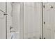 This bright bathroom has a shower and tub combination with clean, white tile at 3255 Sutcliffe Nw Rdg, Marietta, GA 30064