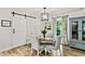 Charming dining area with stylish furniture, a barn door, and a blue china cabinet at 3255 Sutcliffe Nw Rdg, Marietta, GA 30064