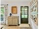 Inviting foyer with stylish decor, a decorative chest, a wooden door, and ample natural light, creating a warm welcome at 3255 Sutcliffe Nw Rdg, Marietta, GA 30064