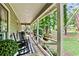 Relaxing covered front porch with rocking chairs and decorative plants, perfect for enjoying the serene surroundings at 3255 Sutcliffe Nw Rdg, Marietta, GA 30064