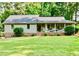 Charming single-story home with manicured lawn and inviting front porch at 3255 Sutcliffe Nw Rdg, Marietta, GA 30064