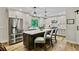 Modern kitchen features white cabinets, stainless steel appliances, an island with seating, and updated fixtures at 3255 Sutcliffe Nw Rdg, Marietta, GA 30064