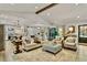 Open-concept living room with modern furnishings and a view into the kitchen and dining area, perfect for entertaining at 3255 Sutcliffe Nw Rdg, Marietta, GA 30064