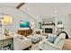 Bright living room featuring a stone fireplace, wood beam, and stylish furnishings, offering a cozy and inviting space at 3255 Sutcliffe Nw Rdg, Marietta, GA 30064