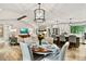 Open concept living and dining area with vaulted ceilings, a fireplace, and modern finishes at 3255 Sutcliffe Nw Rdg, Marietta, GA 30064