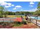 Community tennis courts and swimming pool area overlooking the lake and green spaces at 3255 Sutcliffe Nw Rdg, Marietta, GA 30064