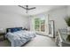 Calm and airy bedroom with a large window, plush carpeting, and neutral decor at 1634 Ponce De Leon Ne Ave # 208, Atlanta, GA 30307