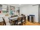 Elegant dining room with built-in cabinets, a wine fridge, and a table for six at 1634 Ponce De Leon Ne Ave # 208, Atlanta, GA 30307
