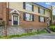 Condominium exterior with brick and siding, front door entryway with the building number at 1634 Ponce De Leon Ne Ave # 208, Atlanta, GA 30307