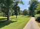 The property features a large green space and mature trees, and a path leads to it at 1634 Ponce De Leon Ne Ave # 208, Atlanta, GA 30307