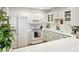 Bright kitchen with white cabinetry, stainless steel appliances, and a breakfast bar at 1634 Ponce De Leon Ne Ave # 208, Atlanta, GA 30307