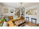 Open living room concept with a large window, leather sofa, and wood floors at 1634 Ponce De Leon Ne Ave # 208, Atlanta, GA 30307